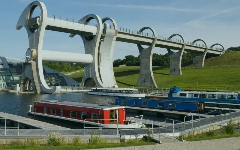The Falkirk Wheel boat lift with canal boats in the basin below
