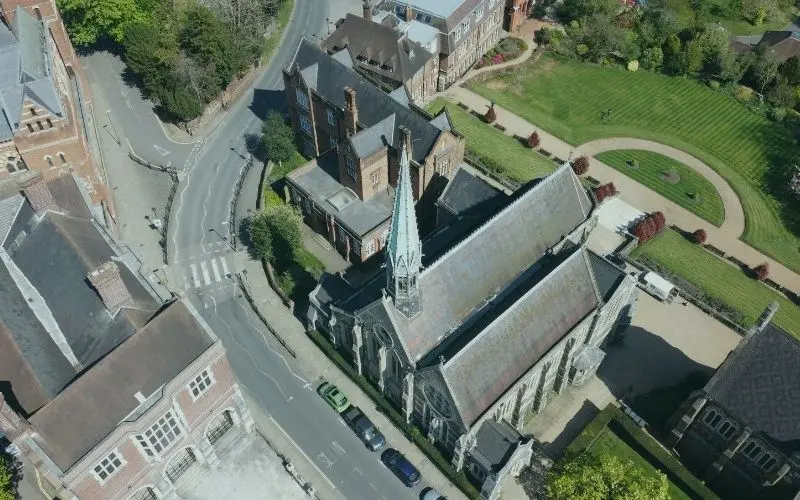 Harrow School's chapel spire and buildings on Harrow on the Hill from above