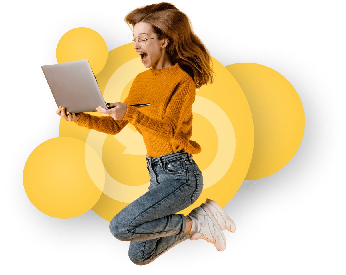 Woman Jumping With Joy With Her Laptop Browsing Broadband Deals