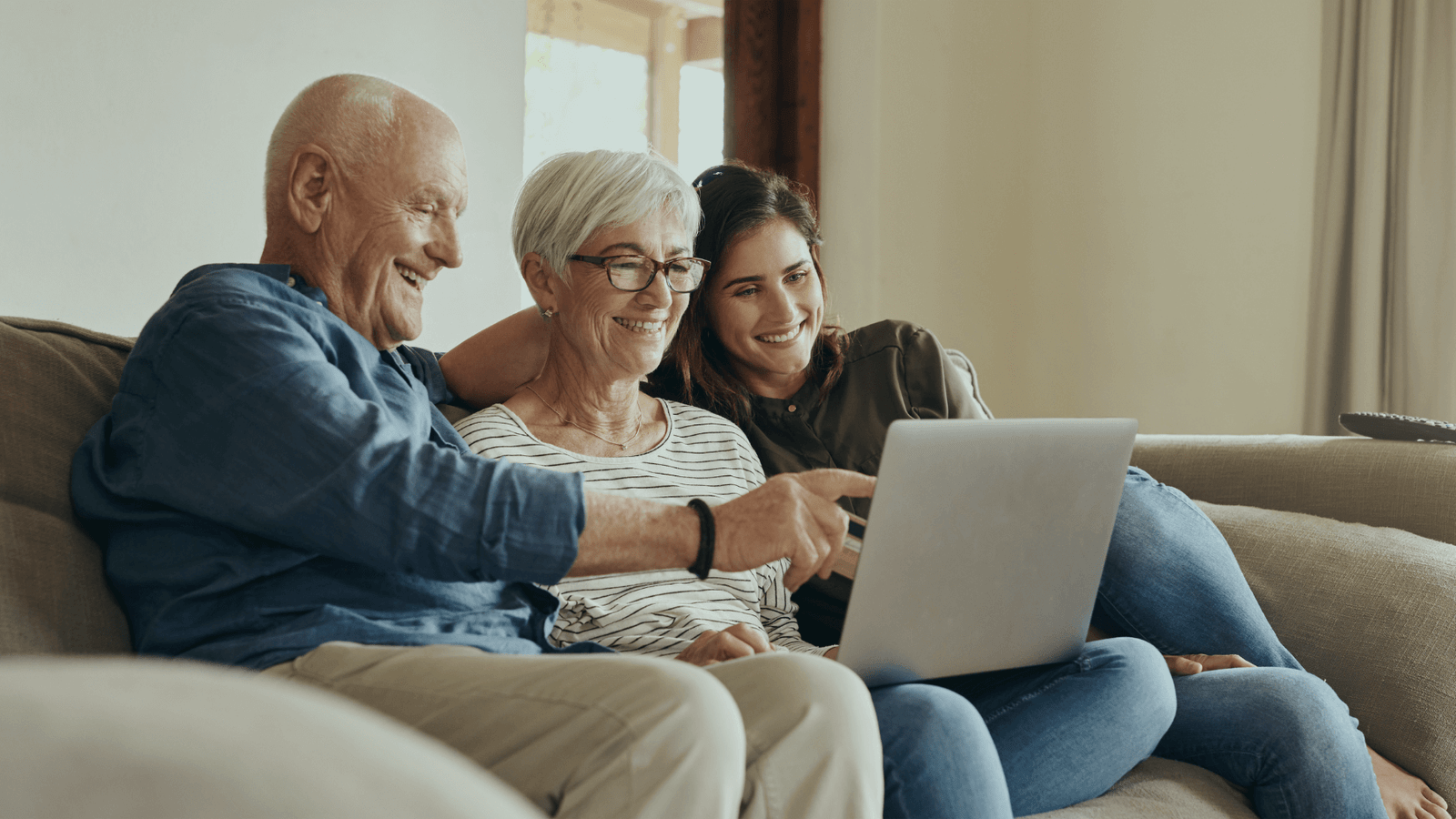 Family reviewing broadband switching rights and consumer protections together on laptop at home